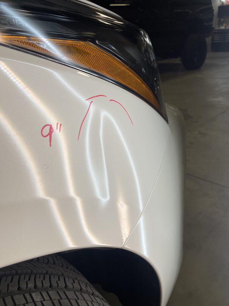 picture of a large dent that can be fixed with paintless dent repair